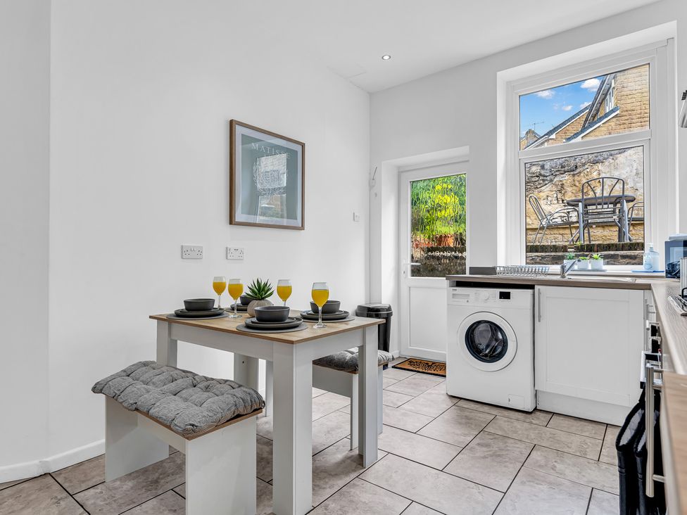 A kitchen with a table and chairs at Peak View Terrace
