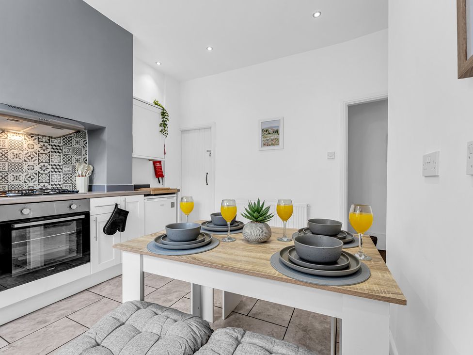 A kitchen with a dining table set at Peak View Terrace