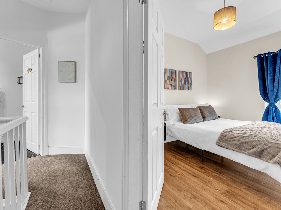A bedroom with a bed and side table at Peak View Terrace