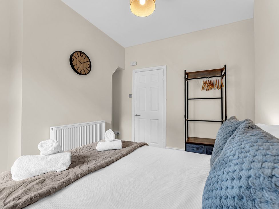 A bedroom with a bed and shelf at Peak View Terrace