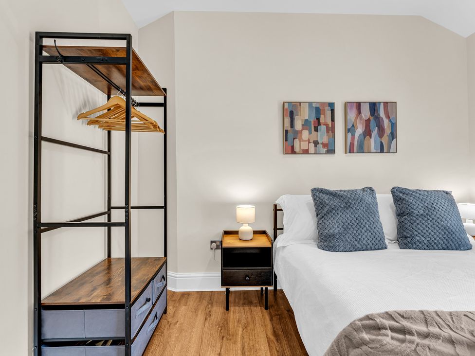 A bedroom with a bed and wardrobe at Peak View Terrace