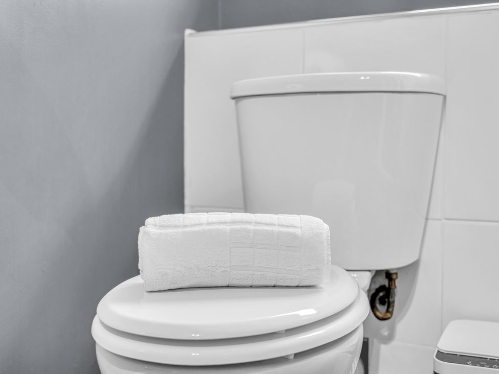 A toilet with a towel on top at Peak View Terrace