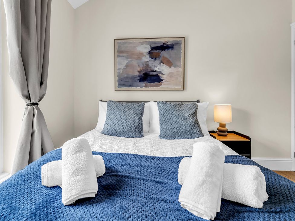 A bedroom with a bed and pillows at Peak View Terrace