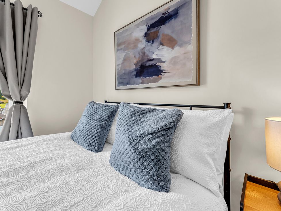 A bedroom with a bed and pillows at Peak View Terrace