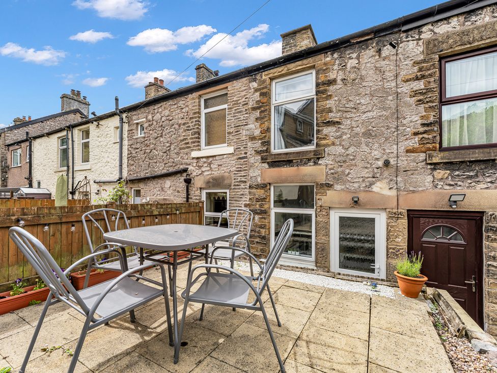 An outdoor patio area with a table and chairs at Peak View Terrace