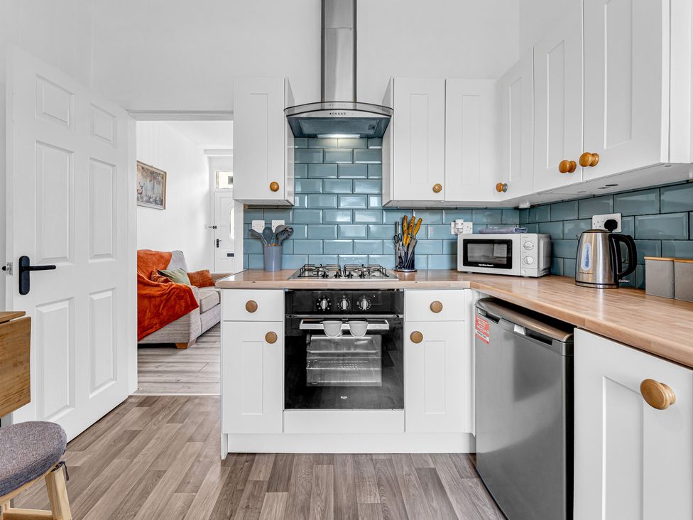 A kitchen with an oven and stove at Peak Side Terrace in Buxton