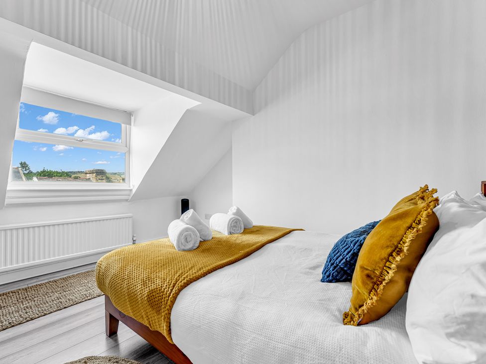 A bedroom with a bed and window at Peak Side Terrace in Buxton