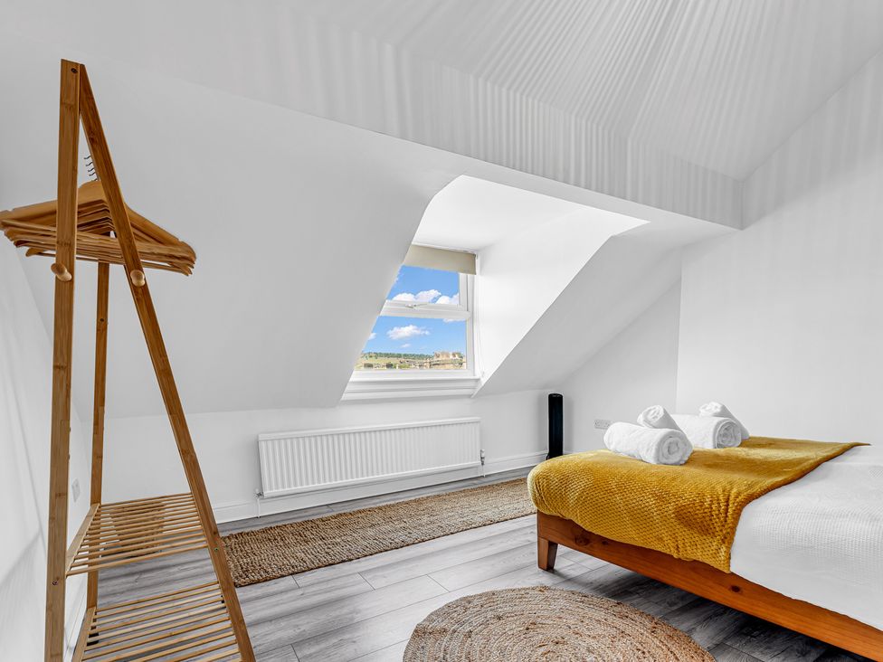 A bedroom with a bed and a window at Peak Side Terrace in Buxton