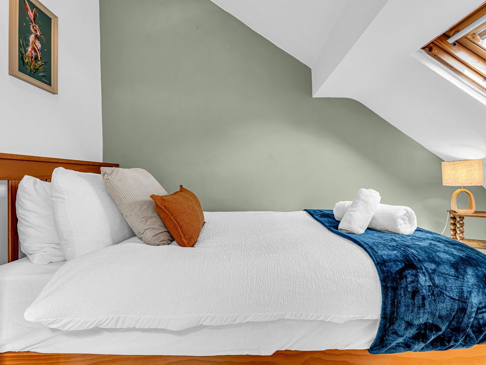A bedroom with a bed and decorative items at Peak Side Terrace in Buxton