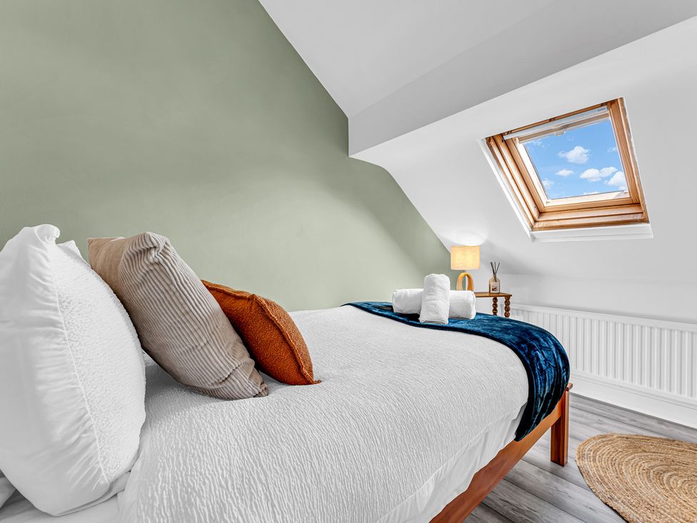 A bedroom with a bed and window at Peak Side Terrace in Buxton