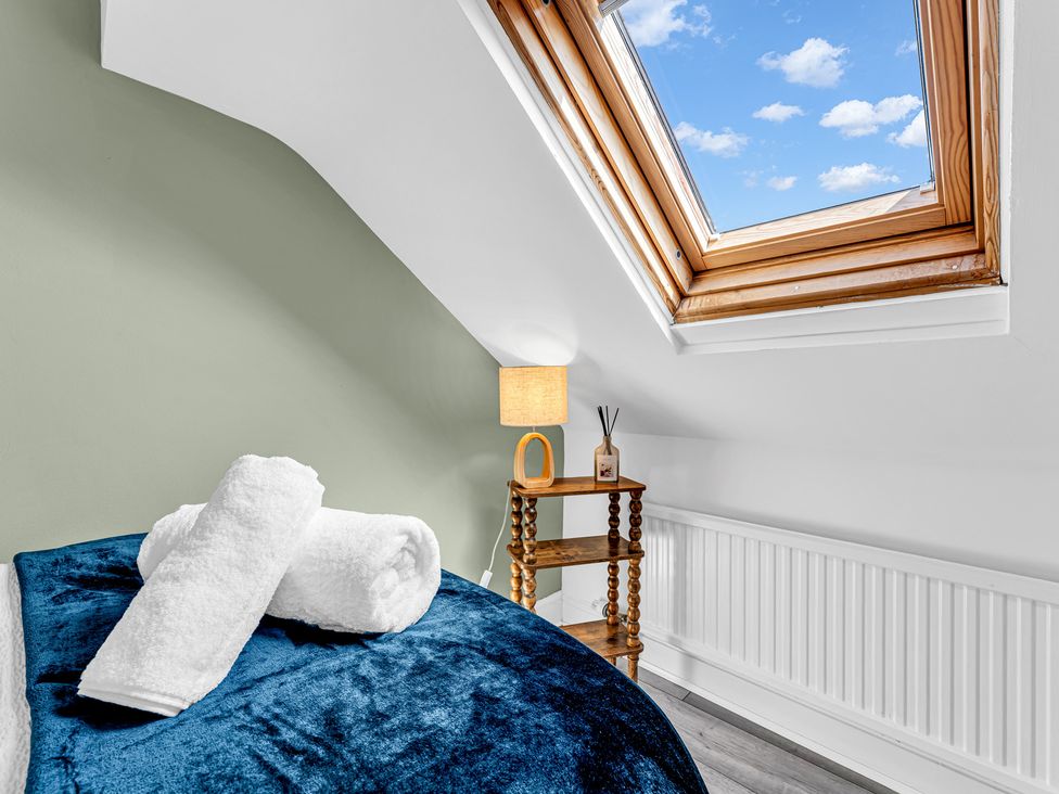 A bedroom with a bed and a window at Peak Side Terrace Buxton