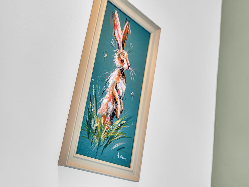 A framed rabbit painting on a wall at Peak Side Terrace in Buxton