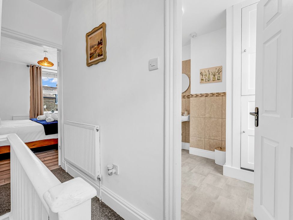 A hallway with a view of a bathroom and room at Peak Side Terrace Buxton