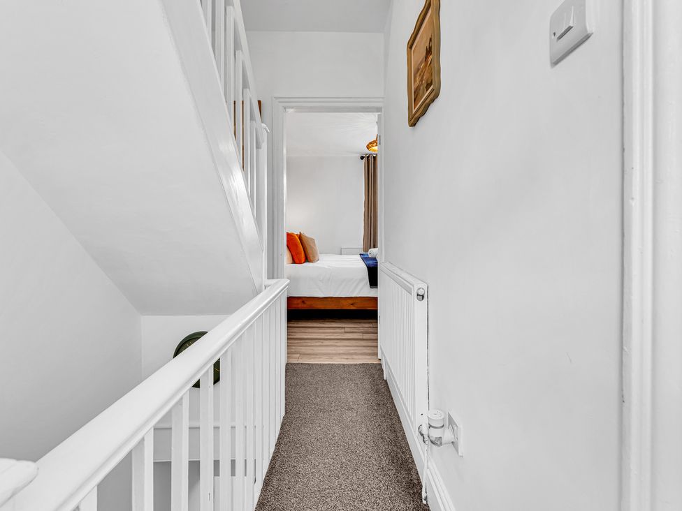 A hallway with a view of a bedroom at Peak Side Terrace in Buxton