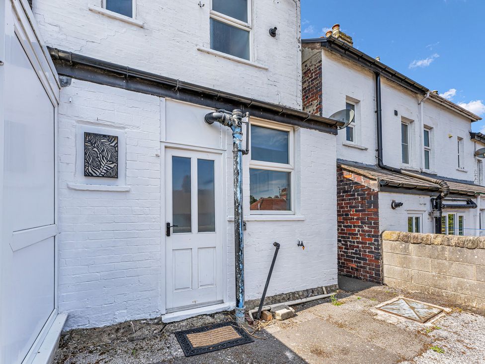 An outdoor area with a door and window at Peak Side Terrace in Buxton