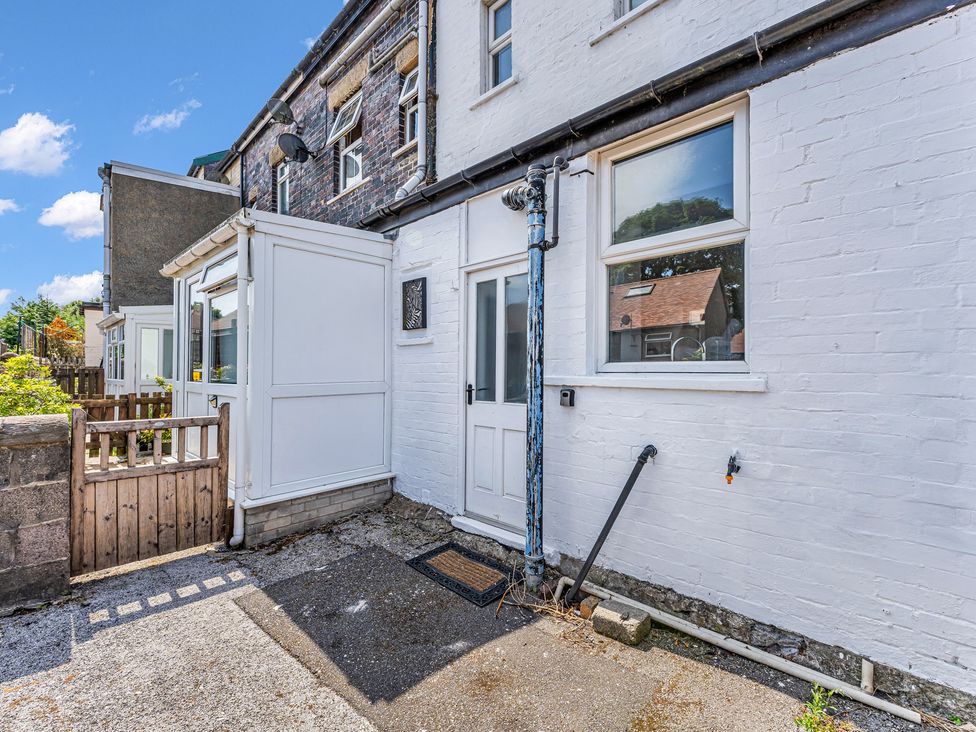 An outdoor area with a door and window at Peak Side Terrace in Buxton