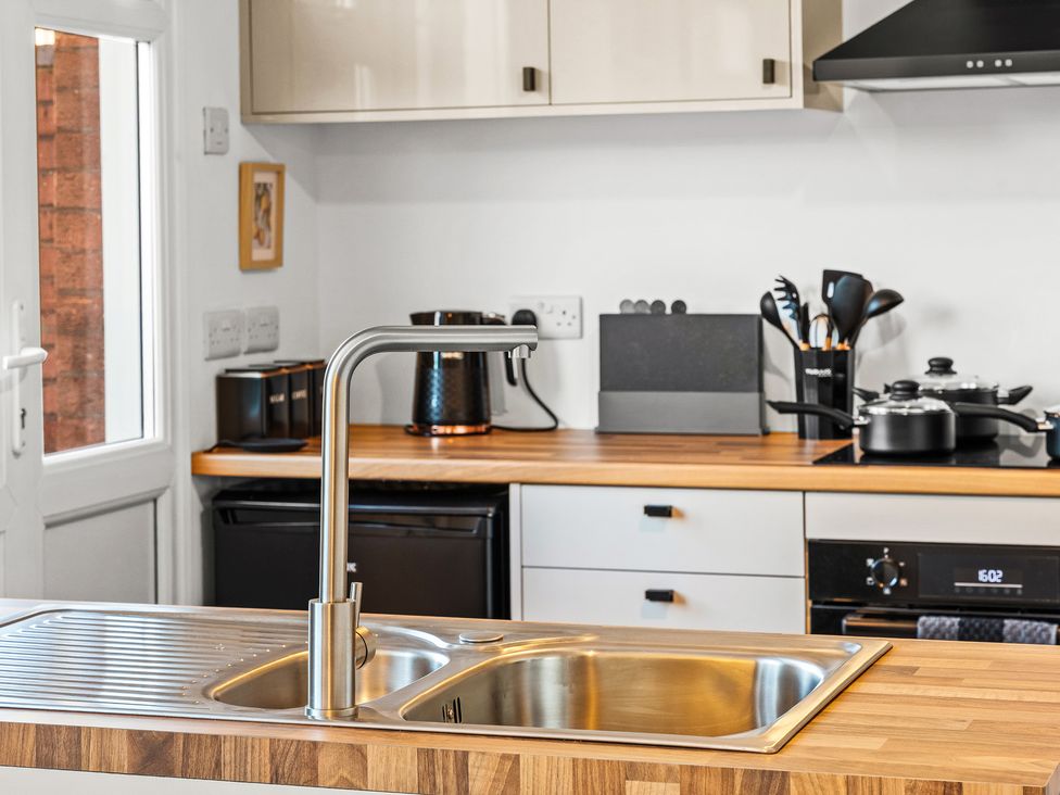 A kitchen with a sink and countertop at Edison House Stafford
