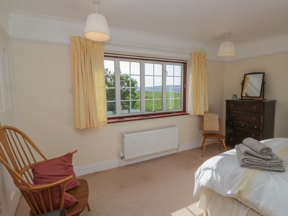 A bedroom with a bed and window at Throstlegarth in Milnthorpe