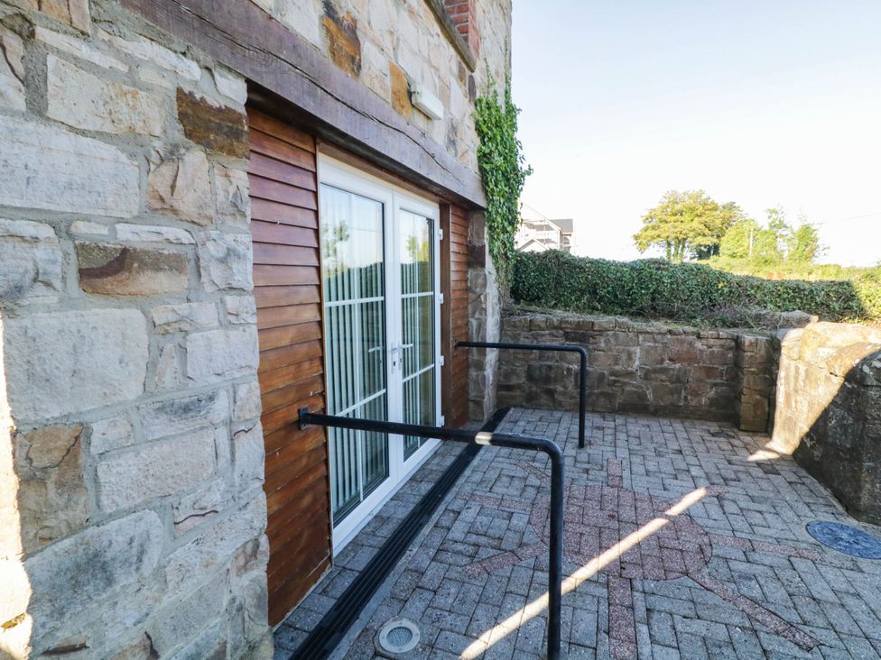 An outdoor area with a door and handrails at The Mummers Studio Apartment 1, Derrylin, County Fermanagh