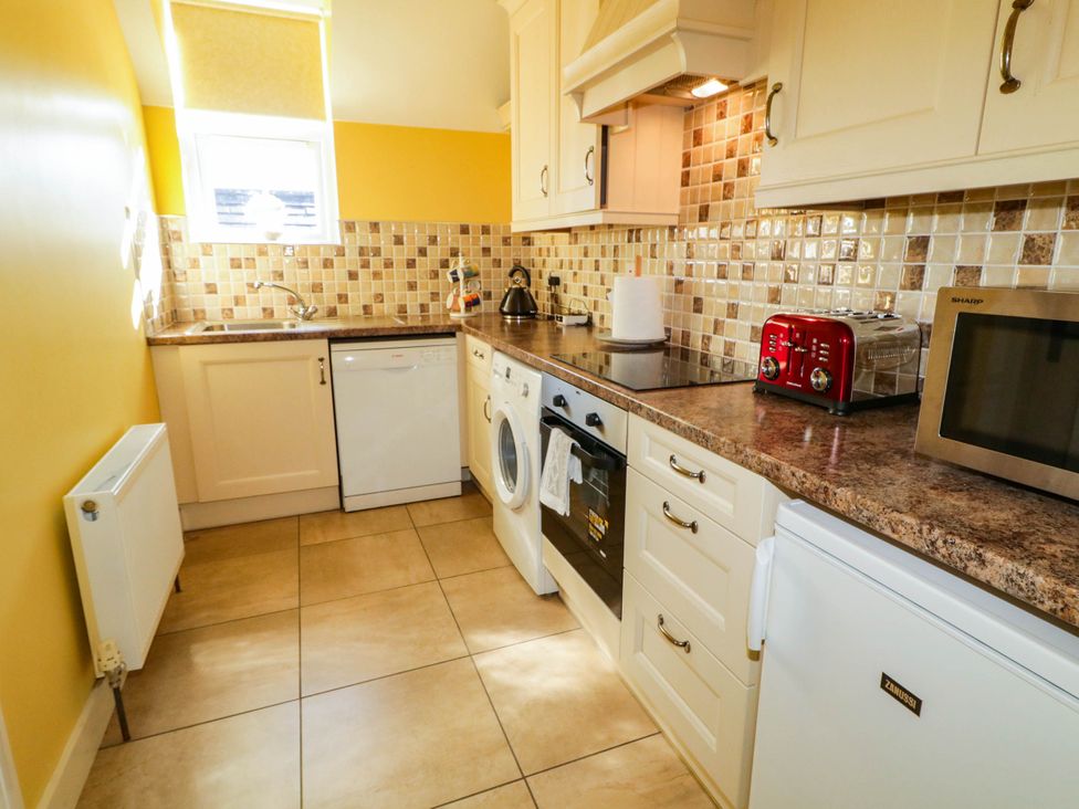 A kitchen equipped with appliances at The Mummers Studio Apartment 1 Derrylin, County Fermanagh