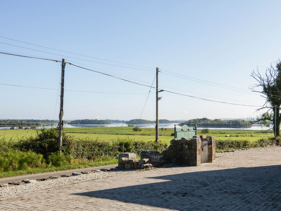 A lake and countryside view with a road at The Mummers Studio Apartment 1 Derrylin, County Fermanagh