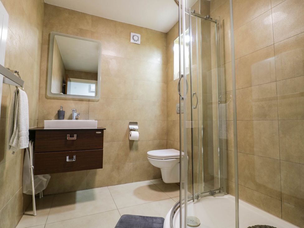 A bathroom with sink and shower at 1 Pump House in Smethwick