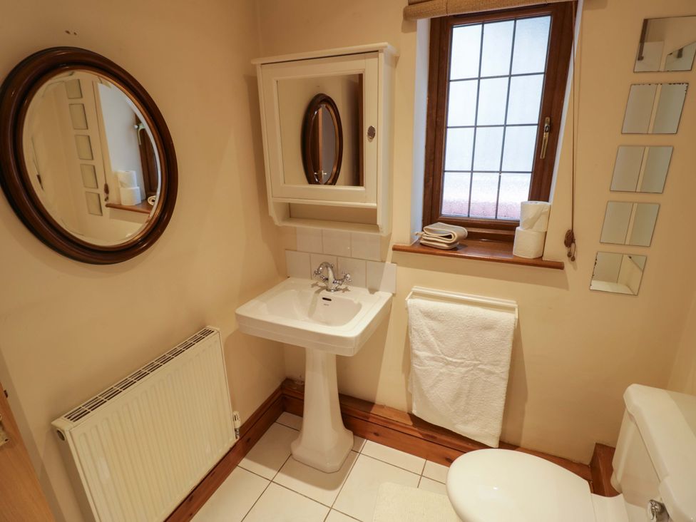A bathroom with a sink and toilet at Meadow View Bungalow in Droitwich