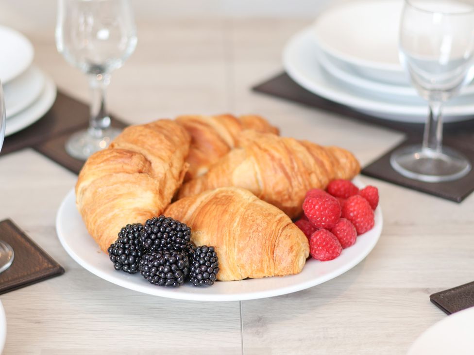 A plate with croissants and berries at Granary in peterculter