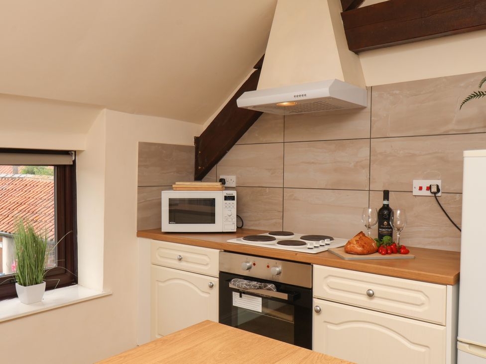 A kitchen with a microwave and stove at Granary in peterculter