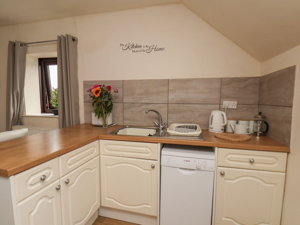 A kitchen with a sink and dishwasher at Granary in peterculter