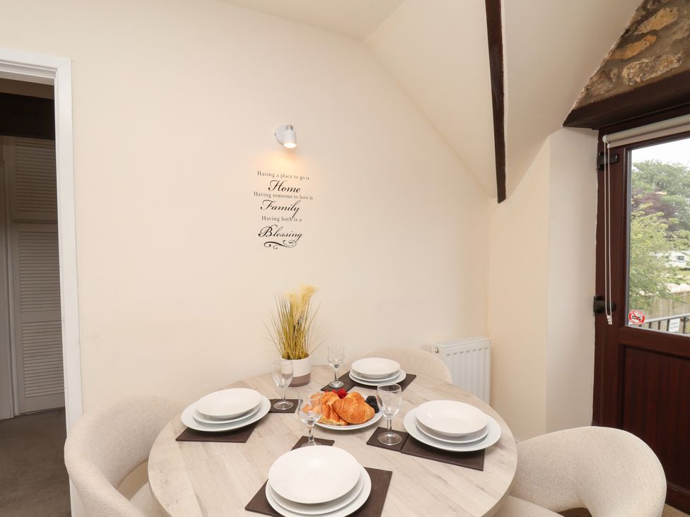 A dining room with a table set for breakfast at Granary in peterculter