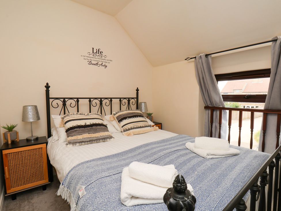 A bedroom with a bed and bedside table at Granary in peterculter