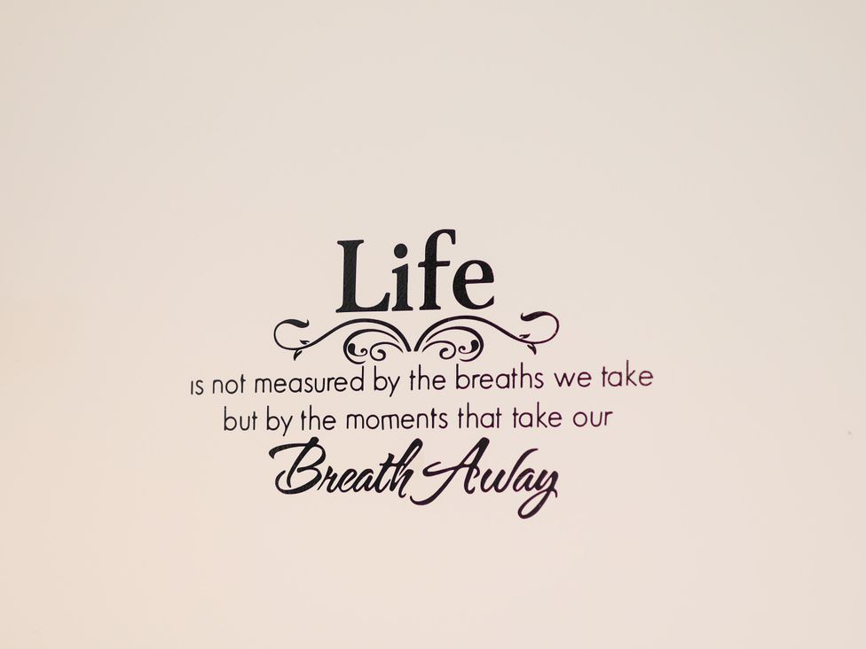 A wall art quote in a neutral room at Granary in peterculter