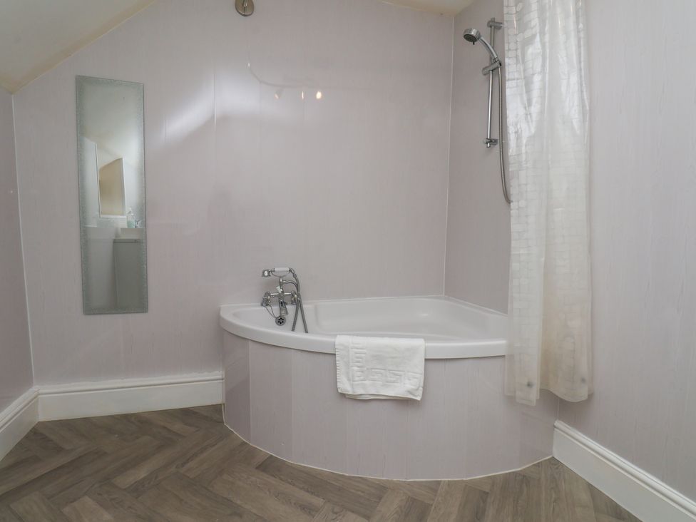 A bathroom featuring a bathtub and shower at Granary in peterculter