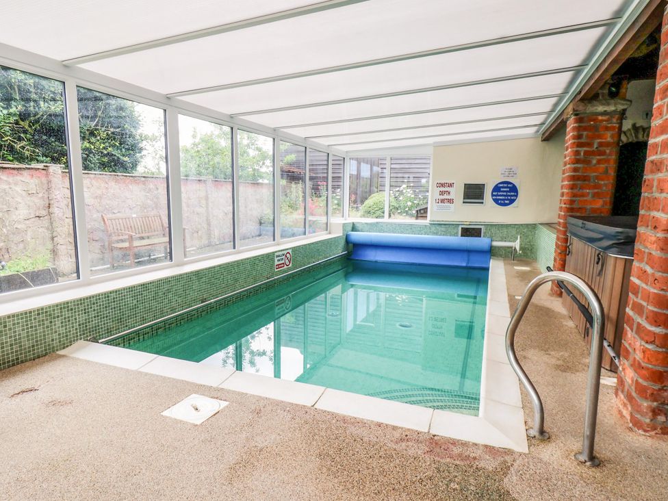 An indoor swimming pool with a pool cover at Granary in peterculter