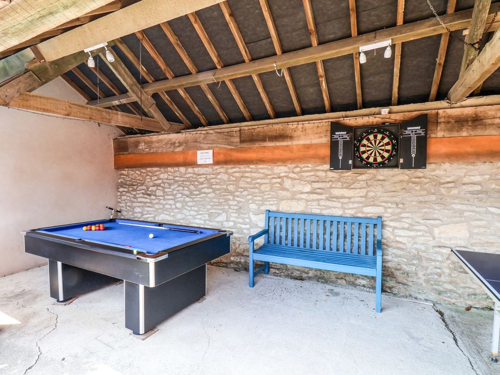 A game room with a pool table and a darts board at Granary in peterculter