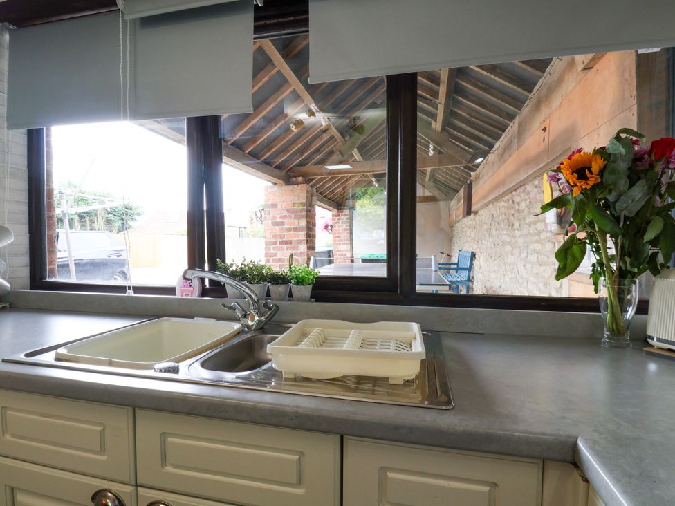 A kitchen with a sink and countertop at Owl in Pickering