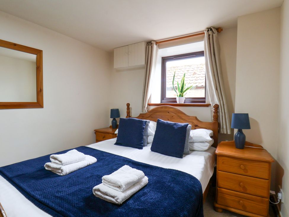 A bedroom with a bed and a window at Owl in Pickering