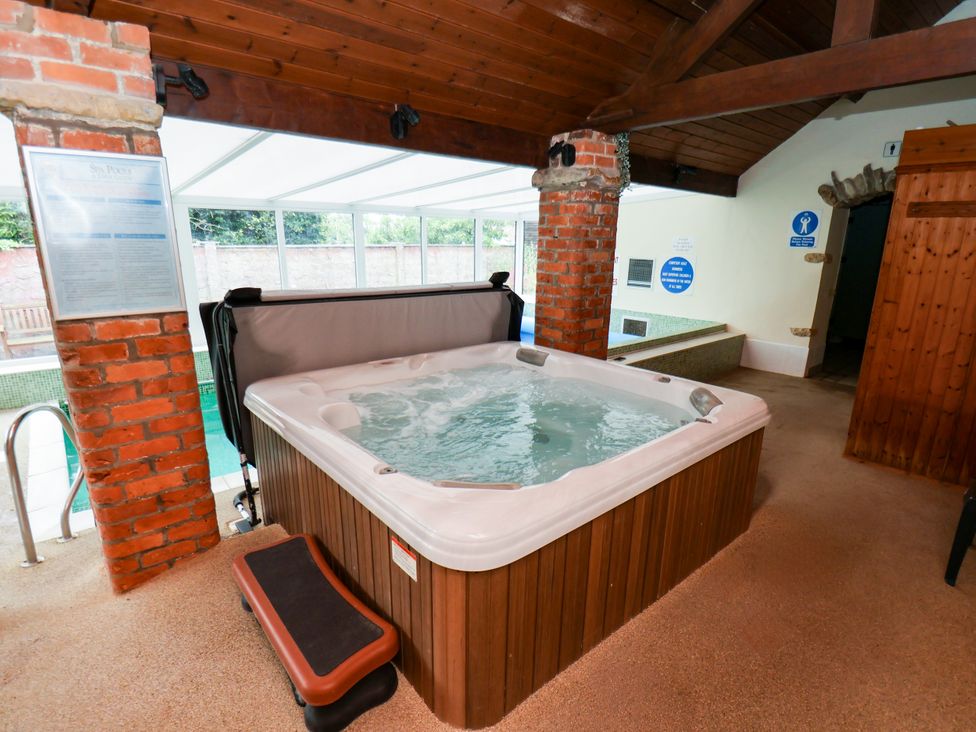 A hot tub in an indoor spa area at Owl in Pickering