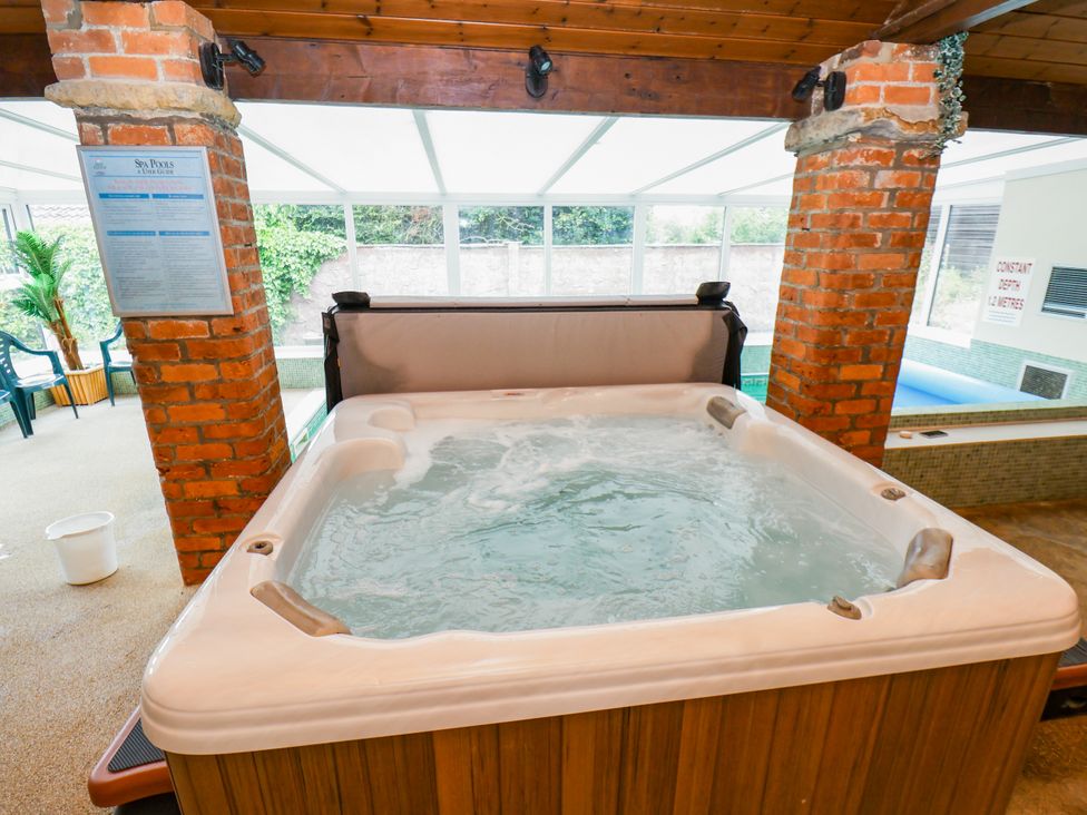 A jacuzzi in an indoor pool area at Owl in Pickering