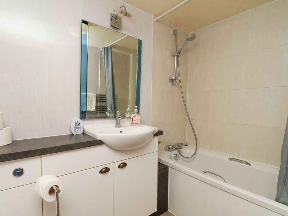 A bathroom with a sink and bathtub at Owl in Pickering