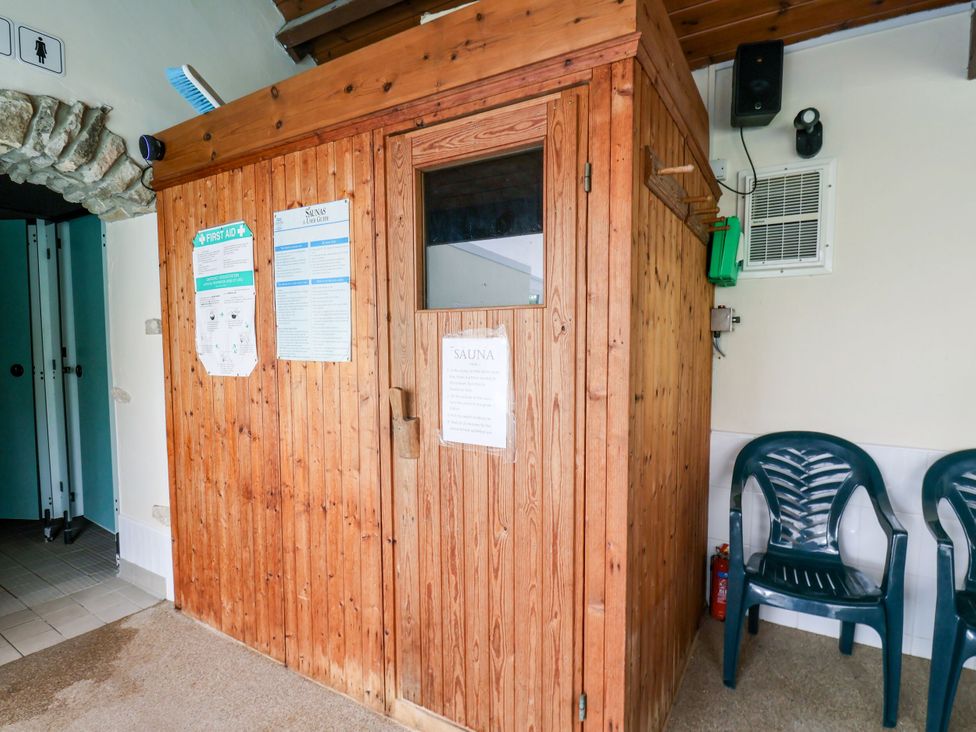 A sauna with seating area at Owl in Pickering