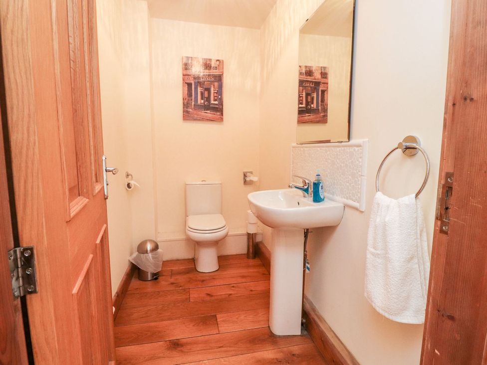 A bathroom with a sink and toilet at Shepherd's Barn in Lancaster
