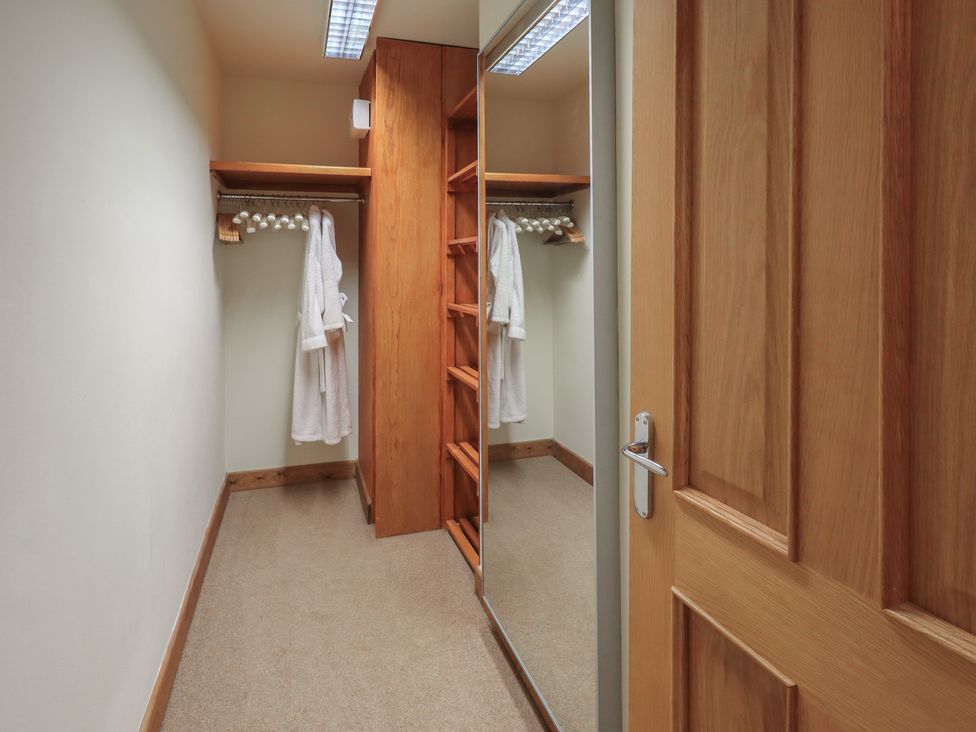 A closet with shelves and a mirror at Shepherd's Barn in Lancaster