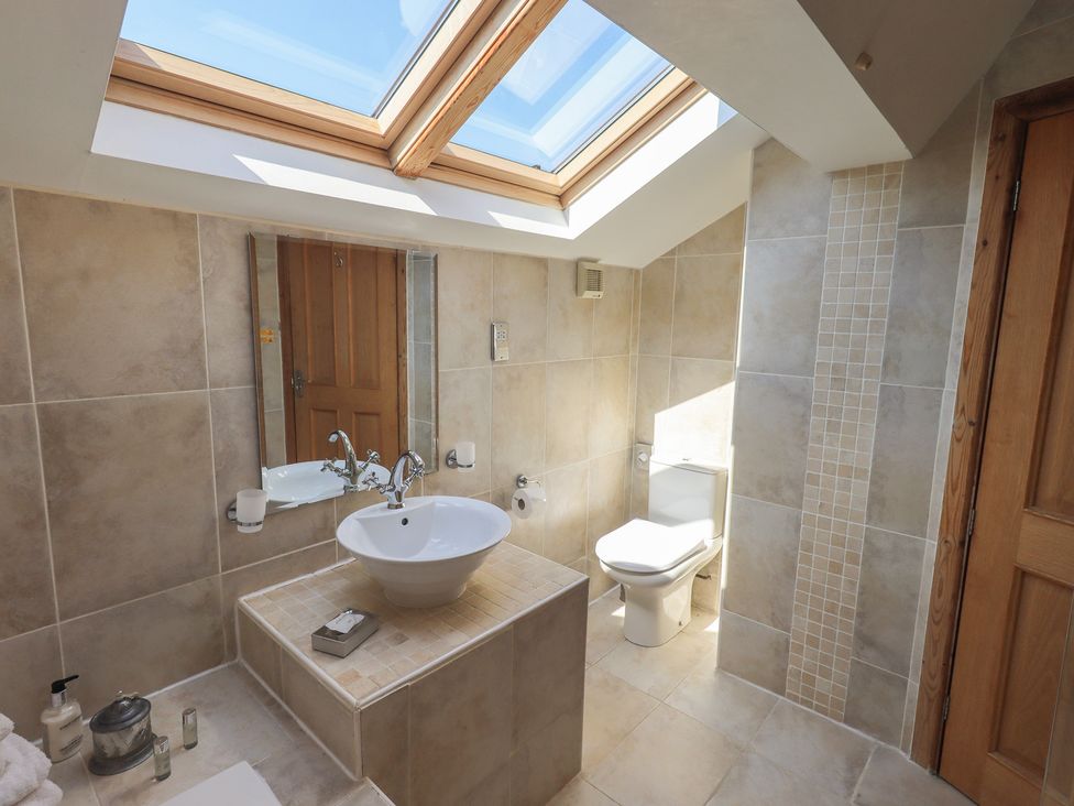 A bathroom with a sink and toilet at Shepherd's Barn in Lancaster