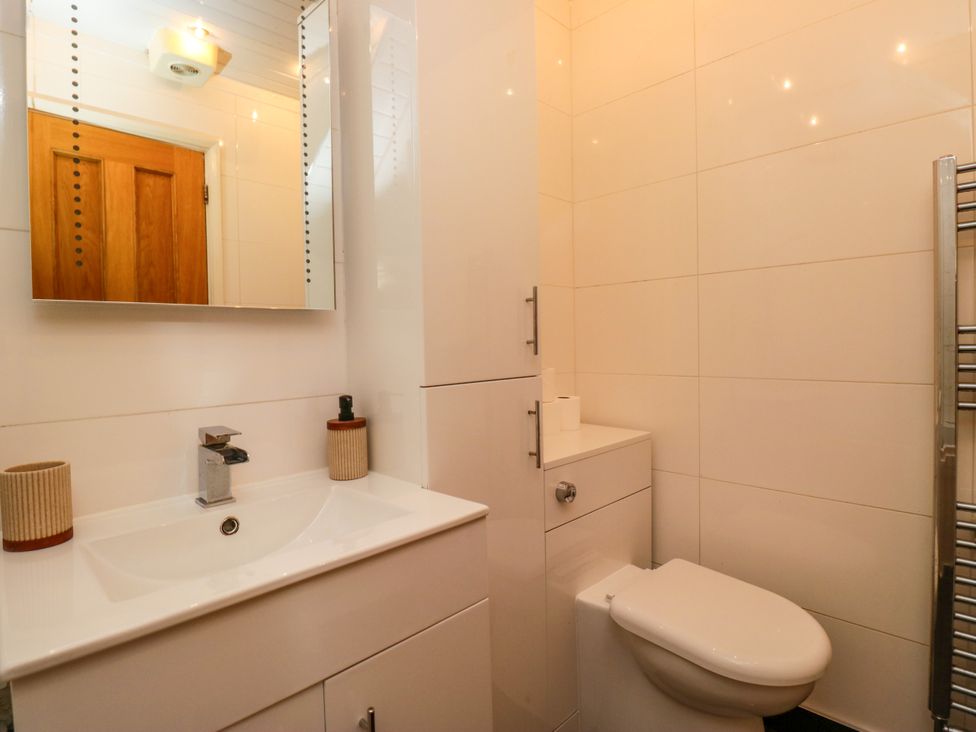 A bathroom with a sink and toilet at Hillside Cottage in Bowness-On-Windermere