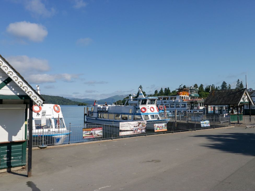 A pier with boats at Hillside Cottage Bowness-On-Windermere