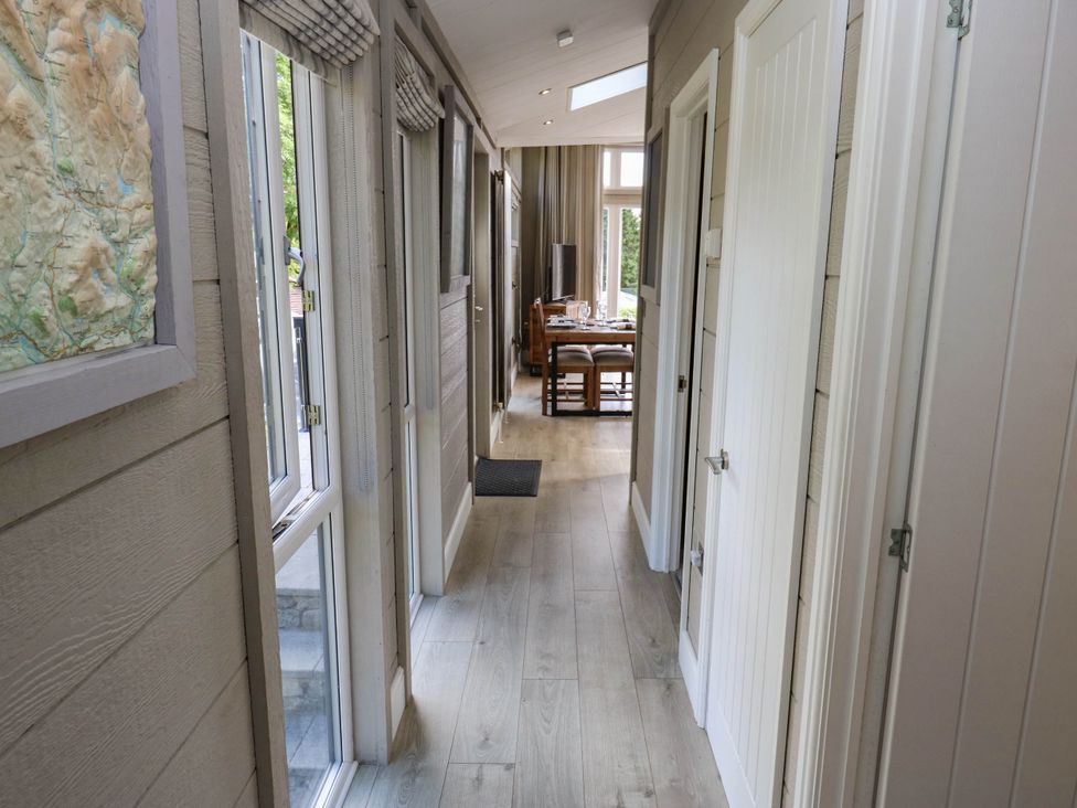 A hallway with doors and a dining area at Dales Retreat Threshfield near Grassington