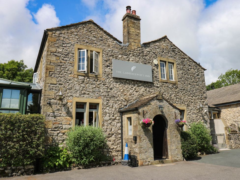 Exterior view of The Gamekeeper's Inn in an outdoor setting near Threshfield