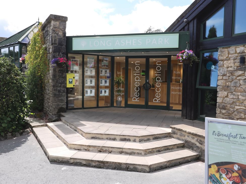 An entrance to Long Ashes Park with reception area and steps at Dales Retreat Threshfield near Grassington